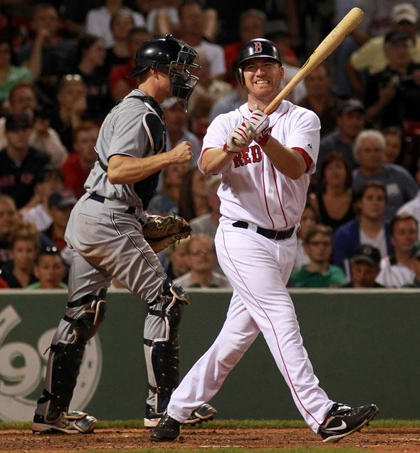 Boston Red Sox right fielder J.D. Drew (7) reacts as he swings and misses for the last out in the 9th ending the Sox's chances for a rally. The Boston Red Sox take on the San Diego Padres in Game 2 of Inter-League Play at Fenway Park