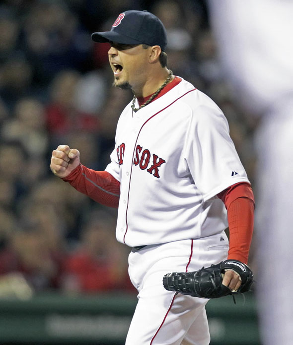 Red Sox starting pitcher Josh Beckett is pumped after 2B Dustin Pedroia made a nice play to retire the Yankees Brett Gardner to end the top of the third inning and get him out of a jam. The Boston Red Sox hosted the New York Yankees at Fenway Park.