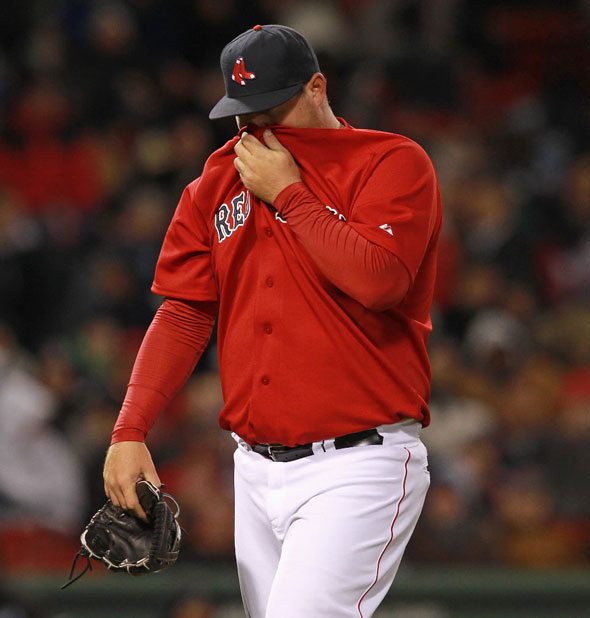 Things fell apart for Boston Red Sox relief pitcher Bobby Jenks (52) and the Sox relievers during the seventh inning.