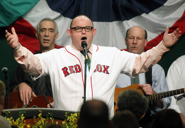 Tenor  Ronan  Tynan sings God Bless America in a Red Sox jersey during the annual St. Patrick's breakfast in Boston, Sunday, March 14, 2010.