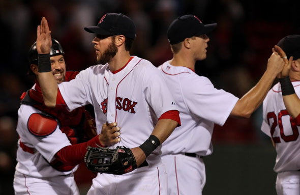 Red Sox vs. Los Angeles Angels - Jeremy Hermida is congratulated by Jason Varitek after the game as Jonathan Papelbon high fives teammates. Hermida doubled in 3 go ahead runs in the 8th inning. 