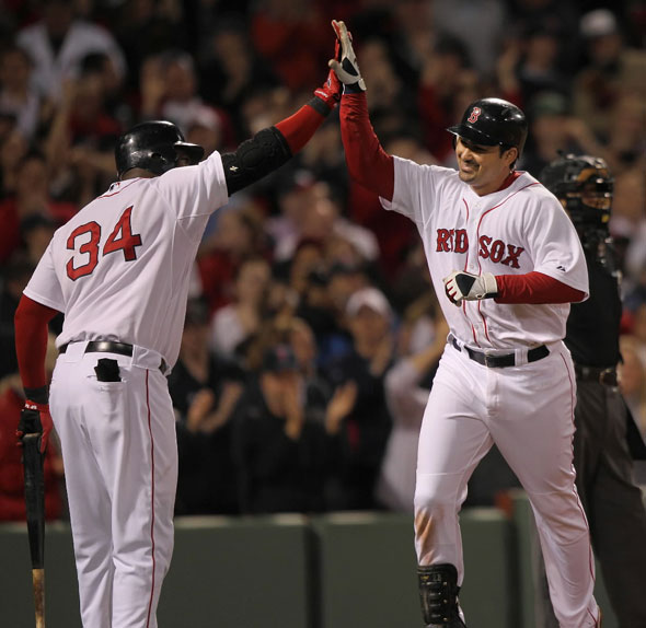 Adrian Gonzalez gets a high 5 from David Ortiz after his solo home run in the 8th inning.