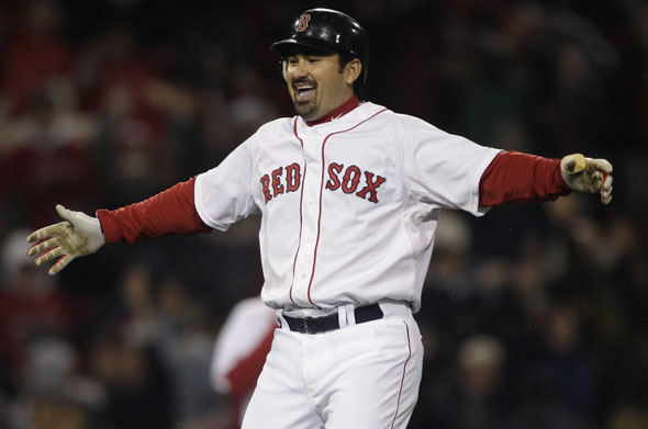 Adrian Gonzalez celebrates after his game-winning, two-run double against the Baltimore Orioles in the ninth inning of a baseball game at Fenway Park in Boston, Monday, May 16, 2011. The Red Sox won 8-7.