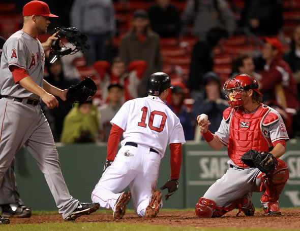 Marco Scutaro was out at the plate trying to score in the 12th inning on a double by Boston Red Sox third baseman Kevin Youkilis, not pictured.