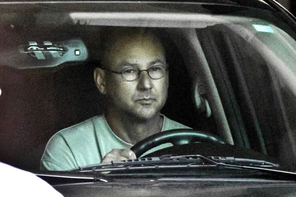 Terry Francona leaves Fenway Park in a black SUV after a meeting with Red Sox management including General Manager Theo Epstein.