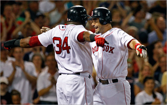 David Ortiz and Mike Lowell celebrate Lowell's homer