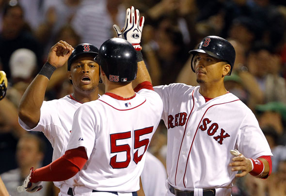  Ryan Kalish is congratulated by teammates Adrian Beltre and Victor Martinez (R) after hitting a grand slam home run against the Tampa Bay Rays during the fourth inning of their MLB American League baseball game at Fenway Park in Boston, Massachusetts September 6, 2010.