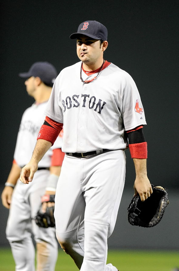 Adrian Gonzalez of the Boston Red Sox walks off the field after a 4-3 loss against the Baltimore Orioles at Oriole Park at Camden Yards on September 28, 2011 in Baltimore, Maryland