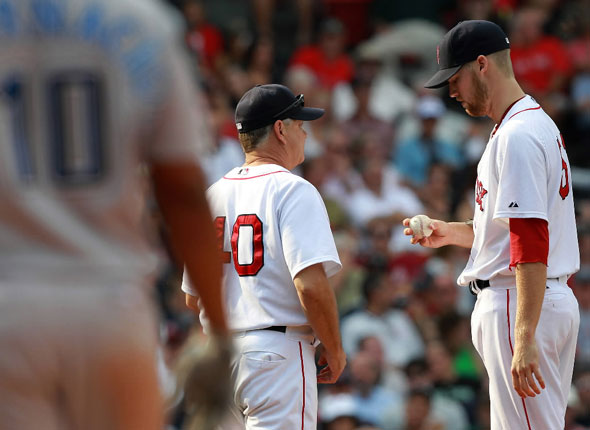 Boston Red Sox pitching coach talks with Boston Red Sox relief pitcher Bard after Bard exhibited an inability to throw a strike walking Toronto Blue Jays designated hitter Encarnacion in the eighth.