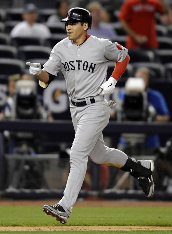 Jacoby Ellsbury reacts as he rounds the bases after hitting a three-run home run during the 14th inning of the second game of a baseball double-header against the New York Yankees, Sunday, Sept. 25, 2011, at Yankee Stadium in New York.